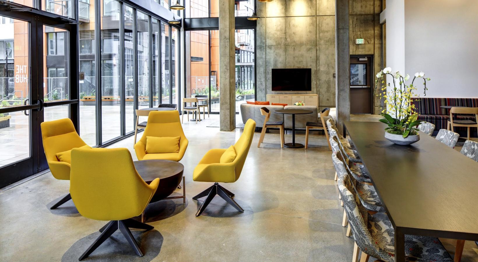 Access to resident-only features a room with tables and chairs