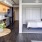 a bedroom with a bed and a table