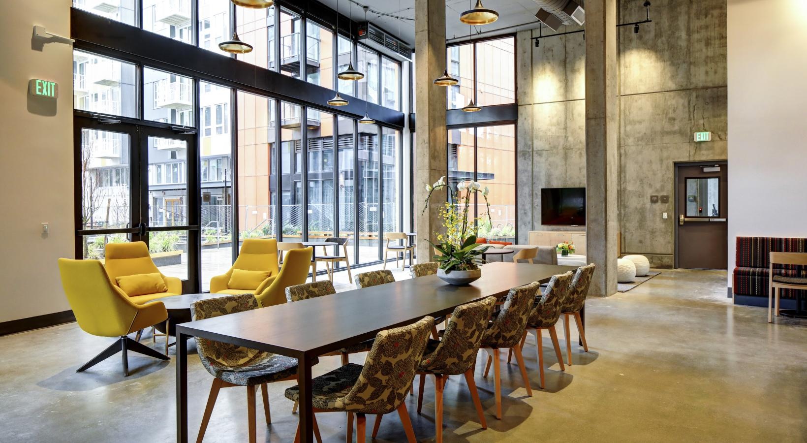 Enjoy our resident-only features a room with a table and chairs