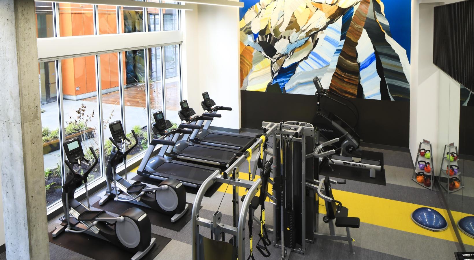 Quick access to state-of-the-art amenities a gym with exercise equipment