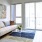 a living room with a couch and a rug