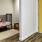 a room with a bed and a yellow door