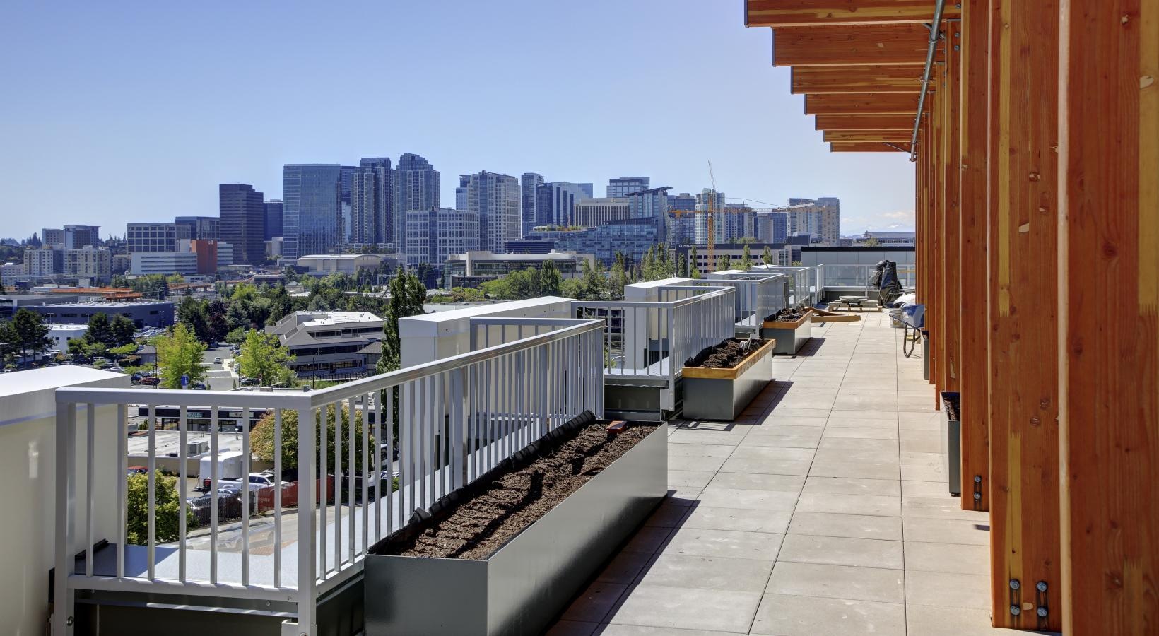 The essence of exceptional living a walkway with railings and a city in the background