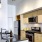 a kitchen with a bar and microwave
