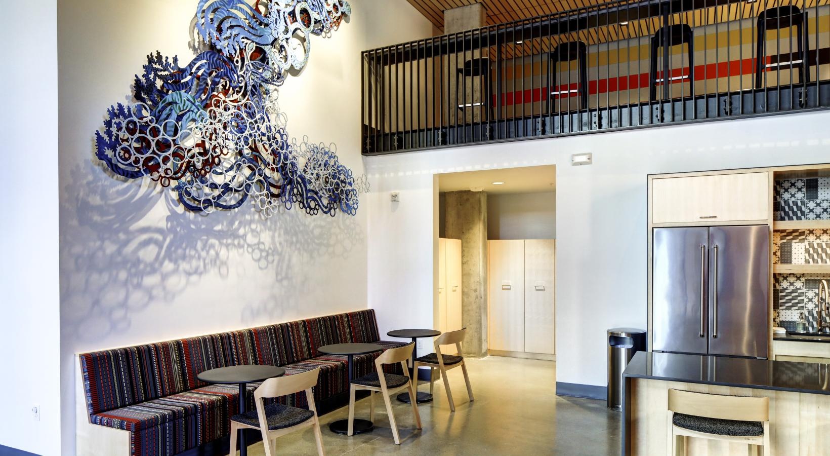 Everything within reach a room with a bar and chairs