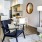 a living room with a dining table and chairs
