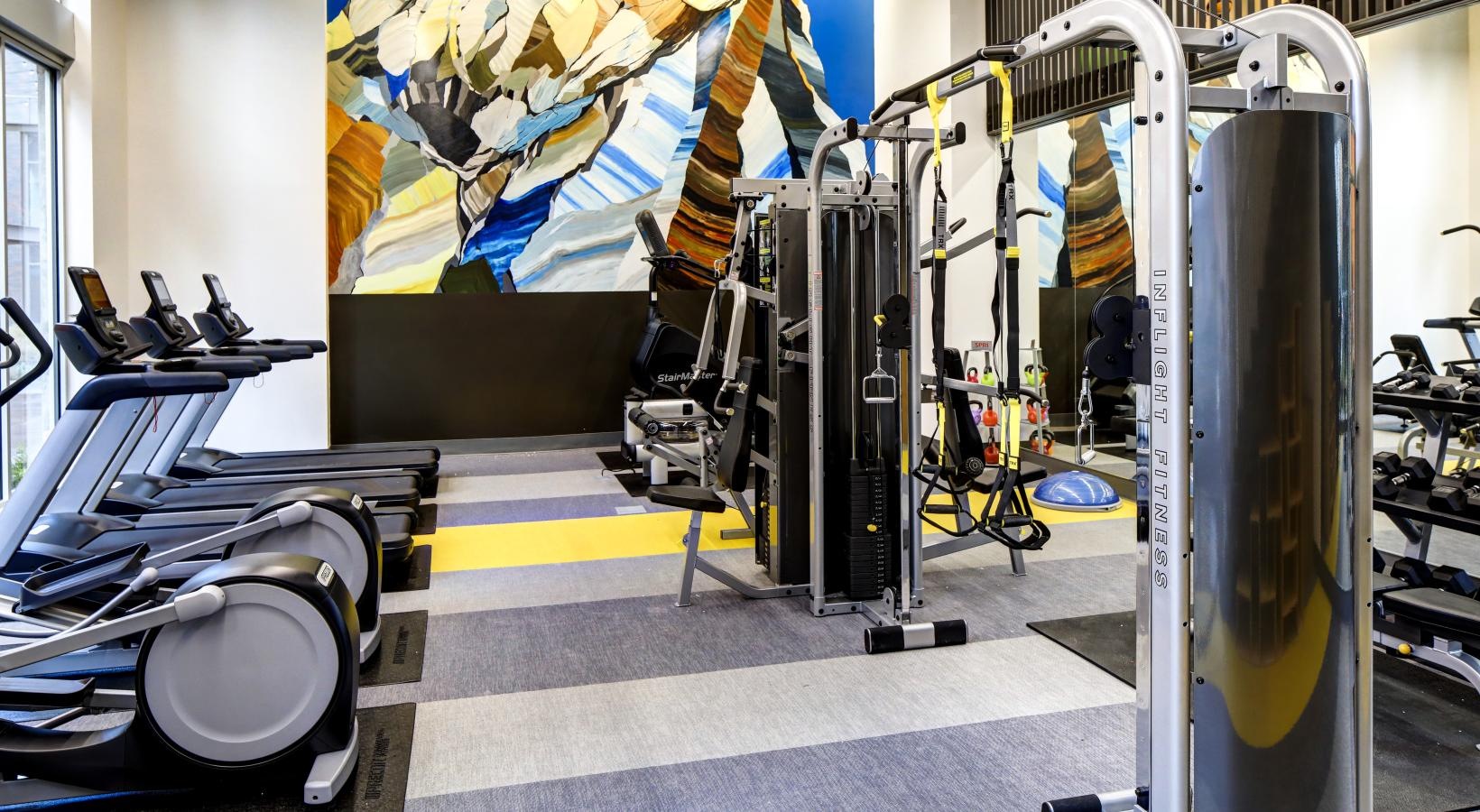 Cutting-edge amenities at your fingertips a gym with exercise equipment