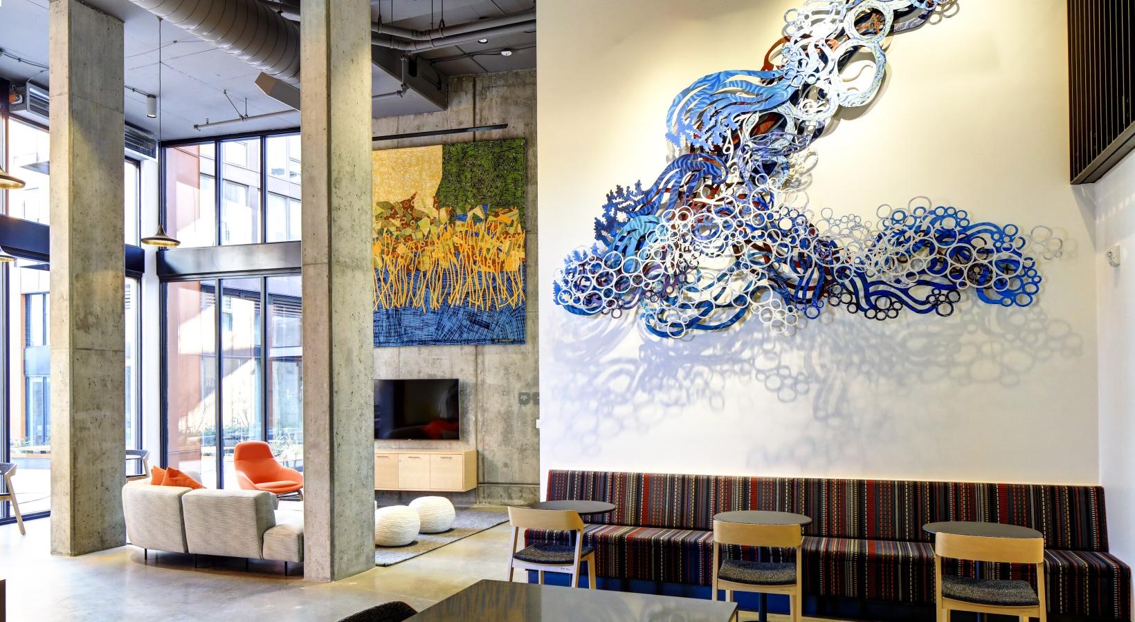 Everything within reach a room with a large painting on the wall