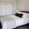 a bed with a white bed spread