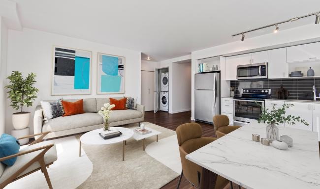 a living room with a white couch and a table