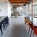 a kitchen with tables and chairs