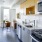 a kitchen with yellow cabinets