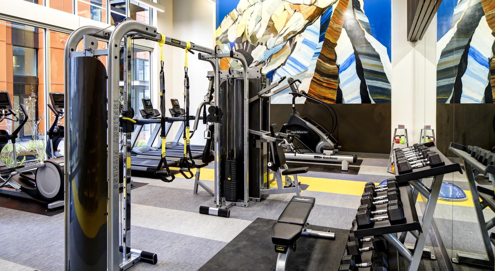 State-of-the-art amenities a gym with exercise equipment
