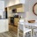 a kitchen with a table and chairs